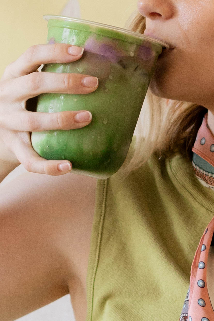 Sipping an iced matcha latte