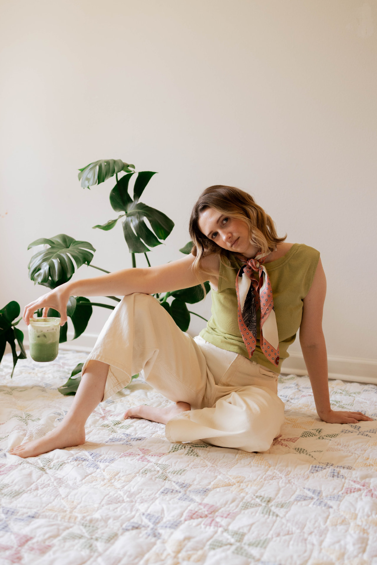 Makail, founder of Matcha Mantra, with a handcrafted iced matcha